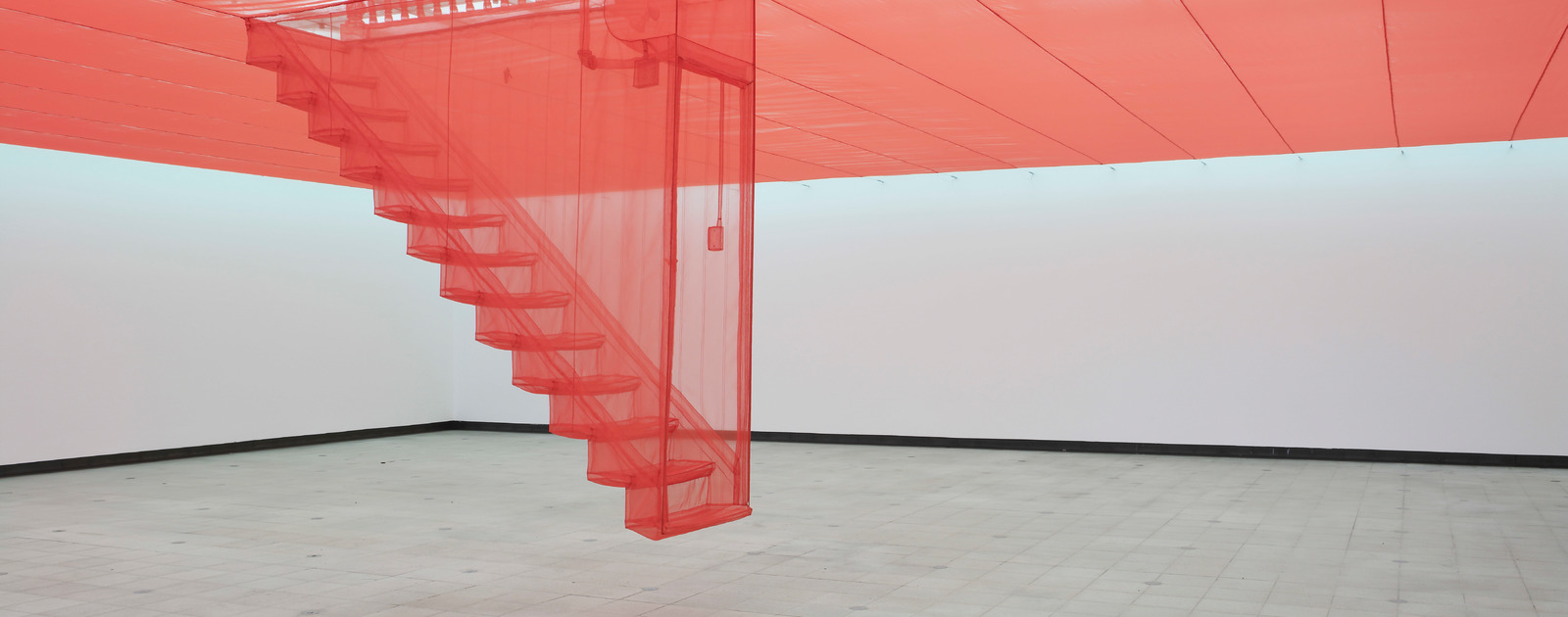 Staircase by Do Ho Suh at PSYCHO BUILDINGS The Hayward Gallery 2008 © Stephen White Red Textile Staircase by artist, Do Ho Suh at Hayward Gallery